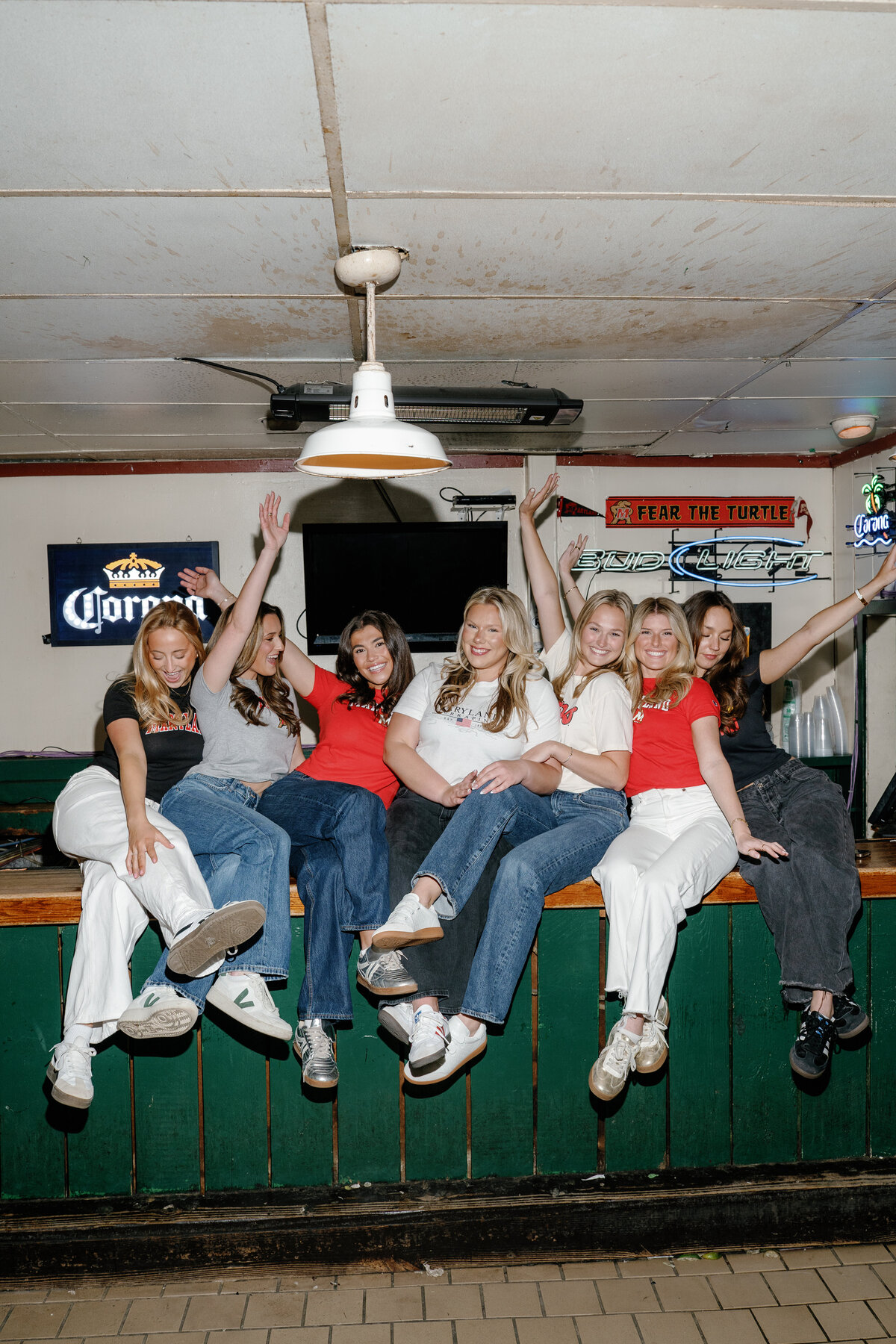 University of Maryland Graduates at RJ Bentley's Bar in College Park Maryland Captured by UMD Graduation Photographer Brenna Marie Photography