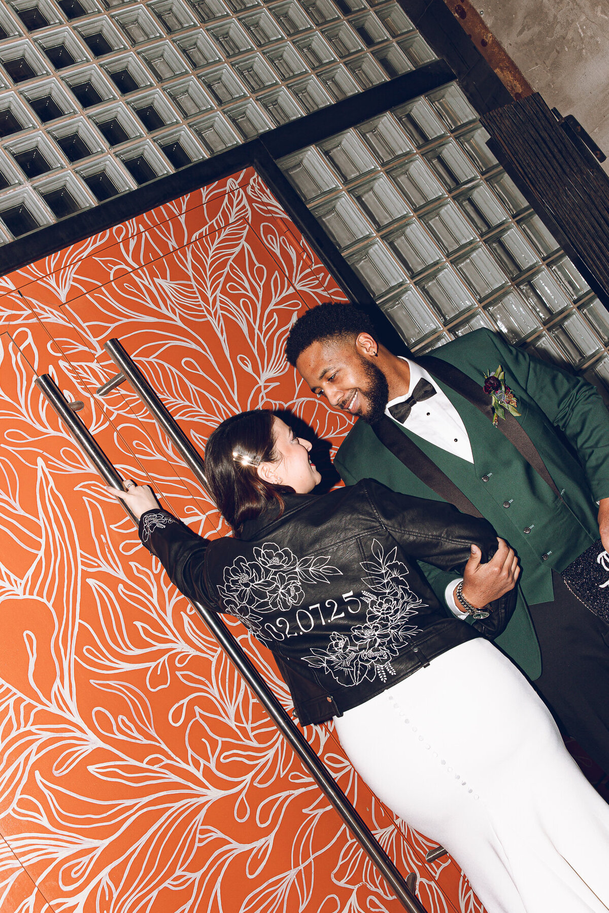 A couple shares a moment outside of The Arbory Chicago on their wedding day in winter