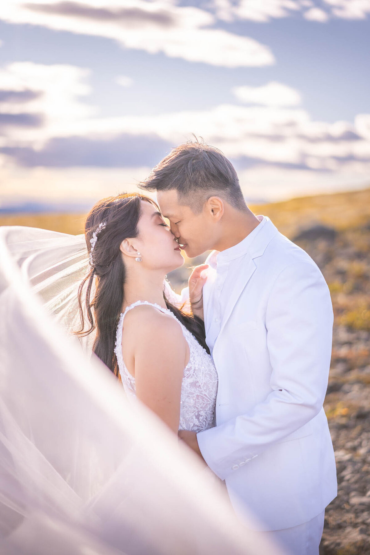 wedding-couple-kissing-sunset