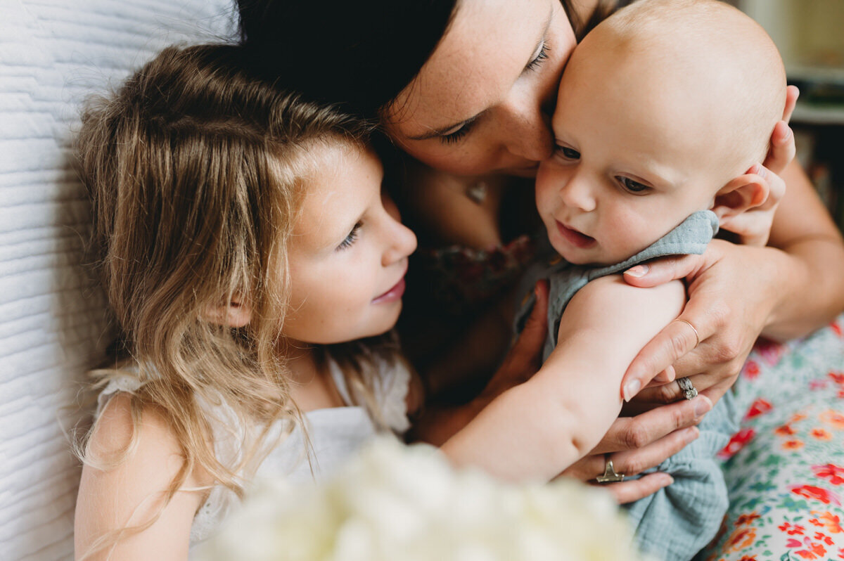 mom kissing baby boy