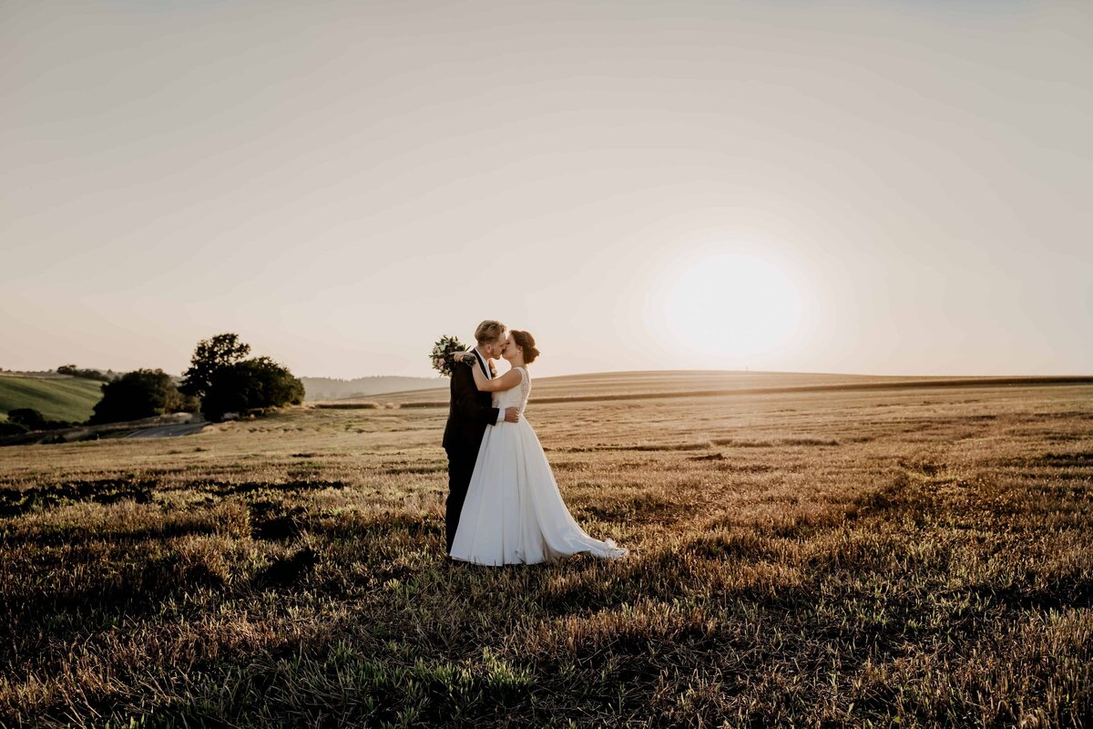 couple-kissing-post-wedding