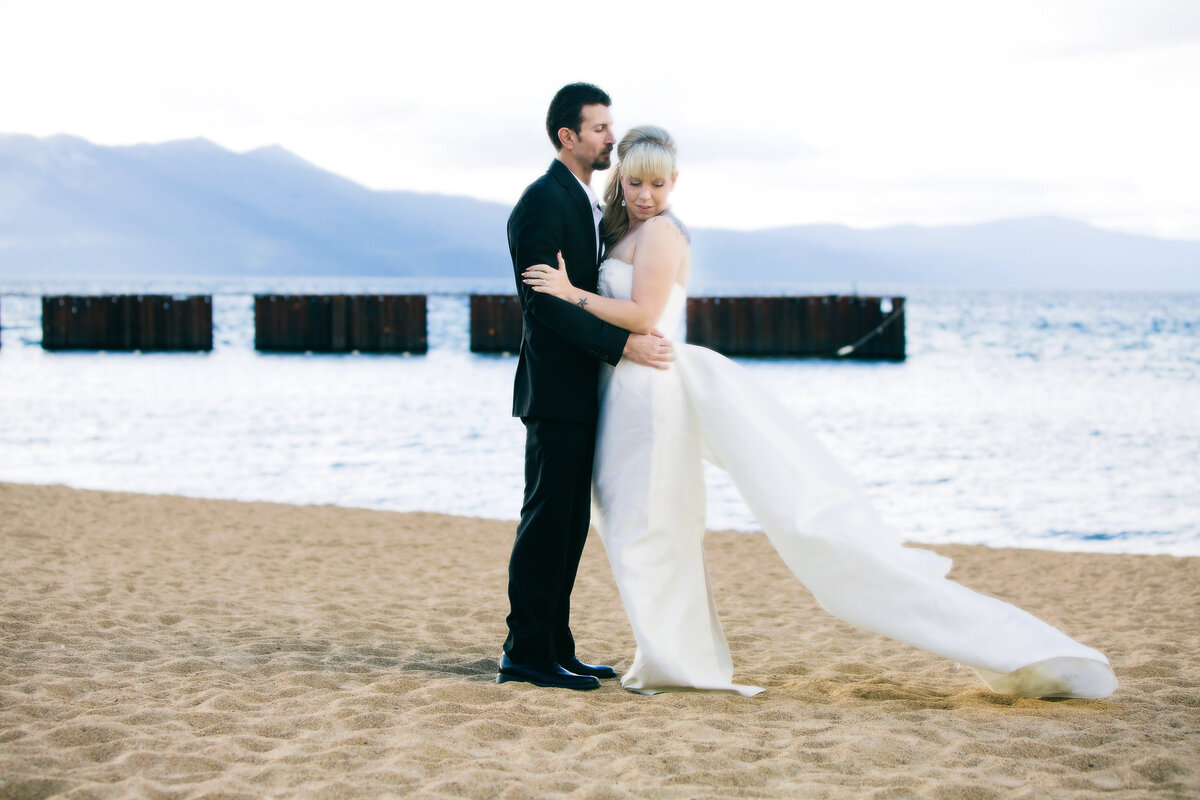 bride and groom on shores of Lake Tahoe
