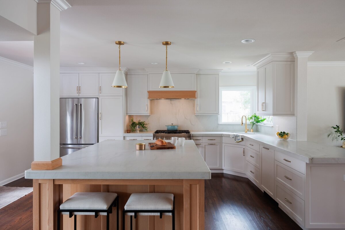 the keeping room interiors oakview kitchen with large island and dark wood flooring