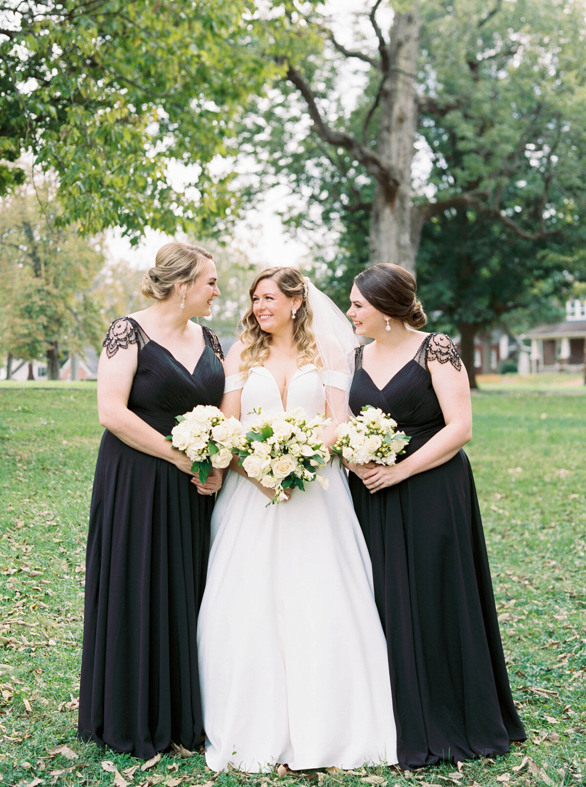Bride and her bridesmaids and in this photo both of her bridesmaids are her sisters