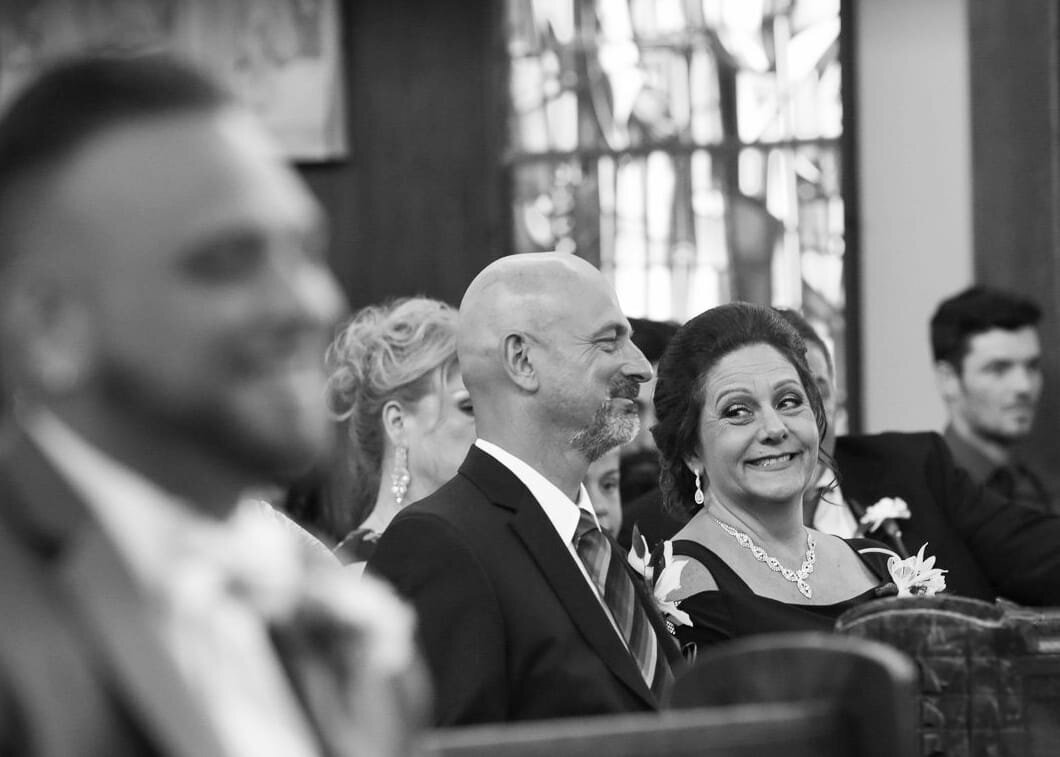 Wedding Guests Smiling at Ceremony