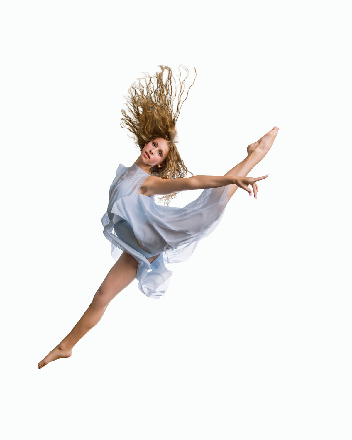 Blonde dancer in a blue flowing dress performing a firebird leap