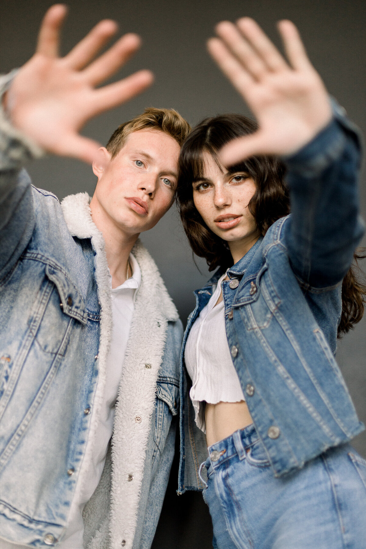 models raisiing their hands towards the camera taken by spokane portrait photographer