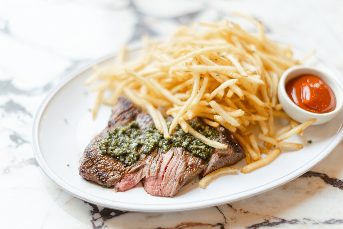 Close up photo of a Sip and Savor menu item of steak and fries taken for their brand session.