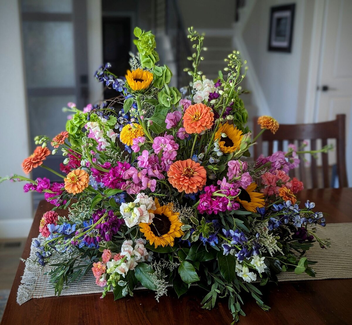 bright funeral flowers garden style