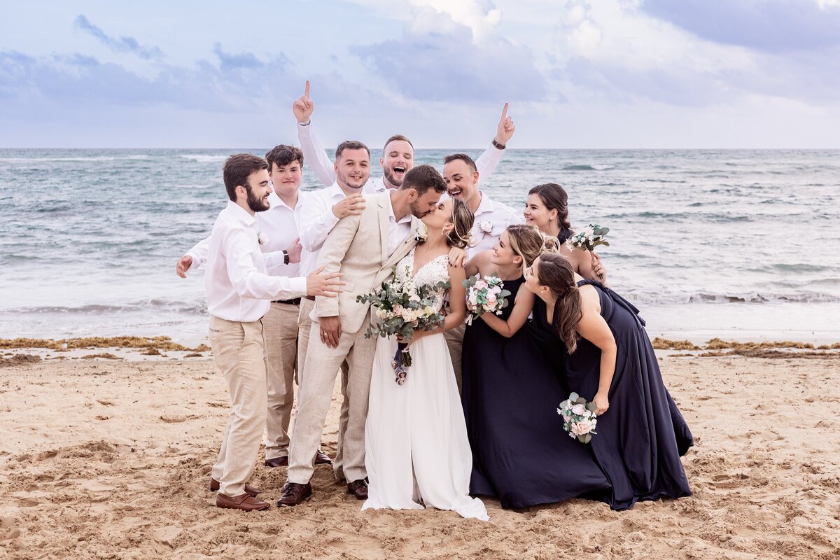 Wedding party showers couple with lose