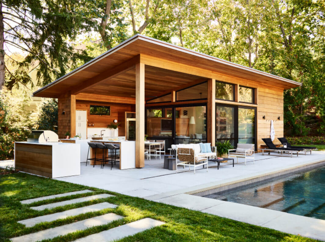 New construction home designer in Boston creates a modern pool house with Estes Twombly and Titrington in Hingham, Massachusetts, blending style and function.
