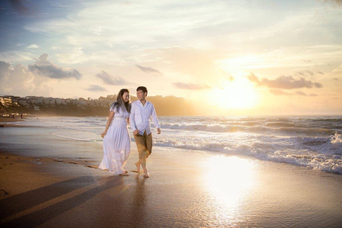 Engaged couple walk along the beach by wedding photographer sacramento, philippe studio pro.