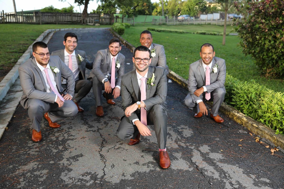 Groom and groomsmen pose together. Photo by Ross Photography, Trinidad, W.I..
