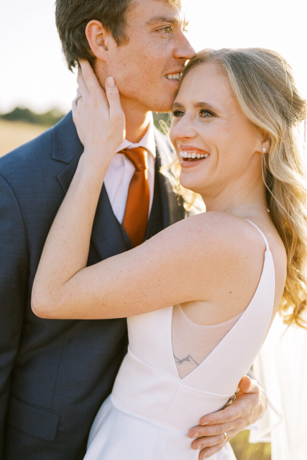 couple-laughing-and-hugging