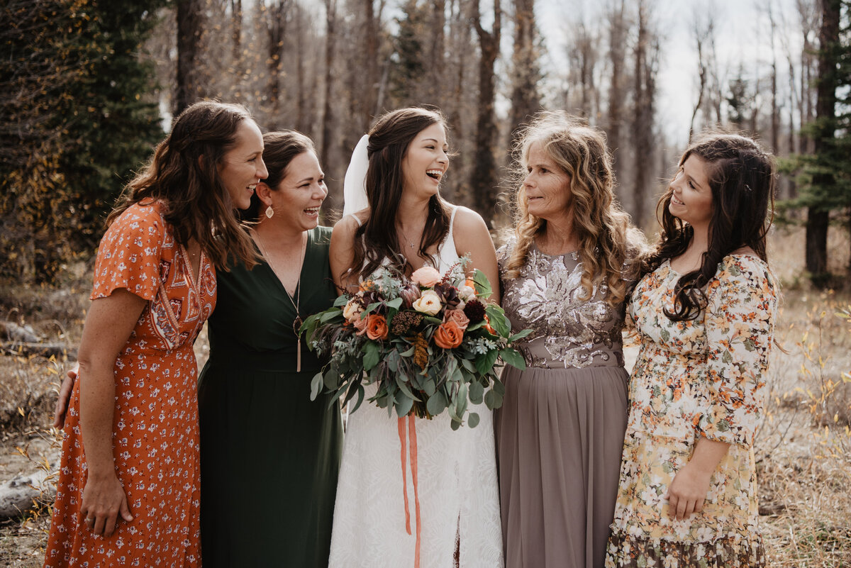 Photographers Jackson Hole capture bride laughing with family