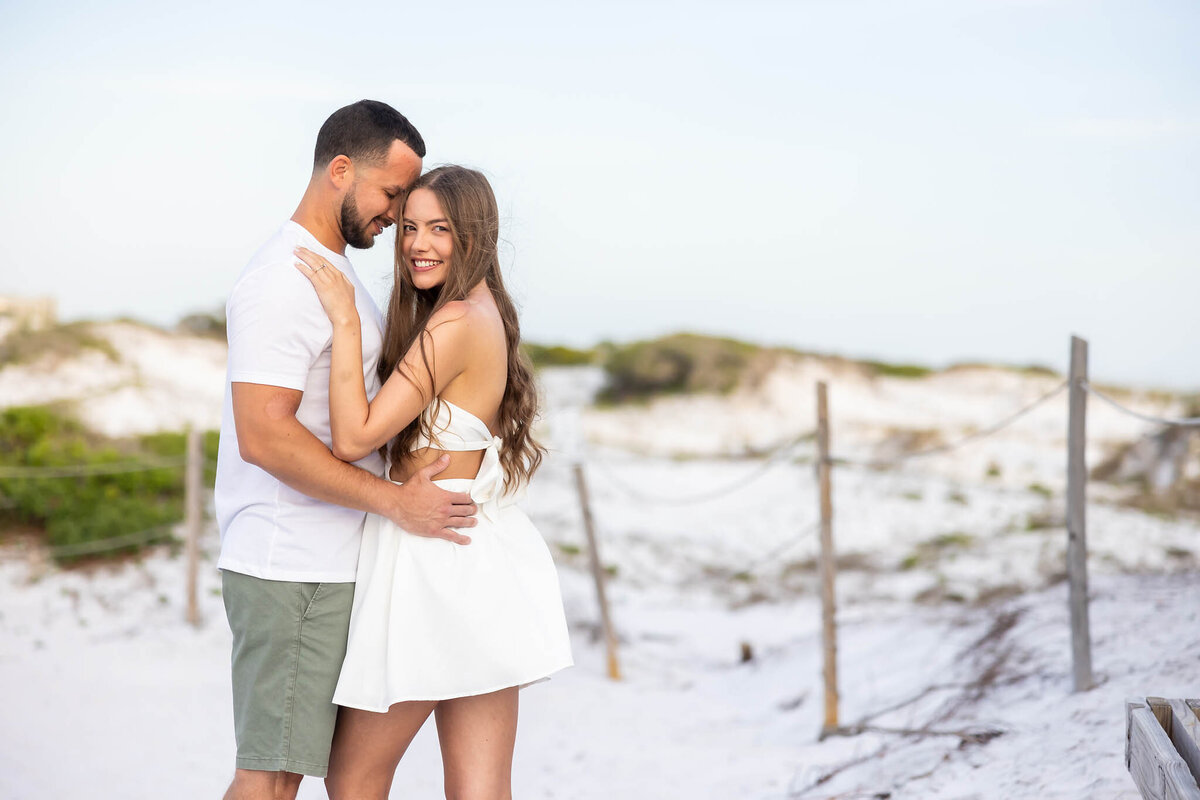 newly married couple honeymooning on 30a taking pictures at grayton beach state park.