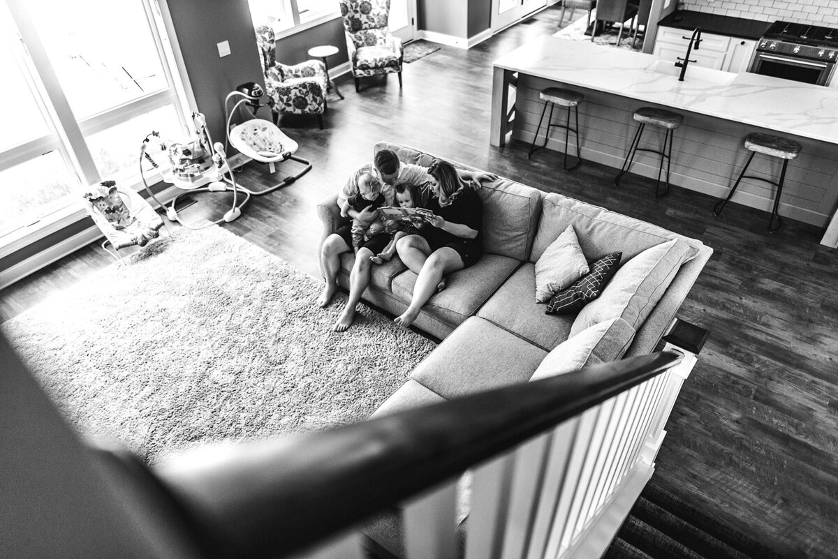Family cuddling in-home lifestyle photography