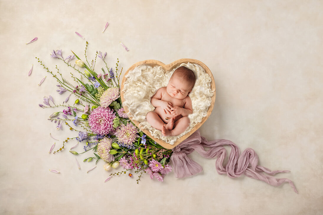 Infant posed for Newborn Photoshoot in Charleston, SC.