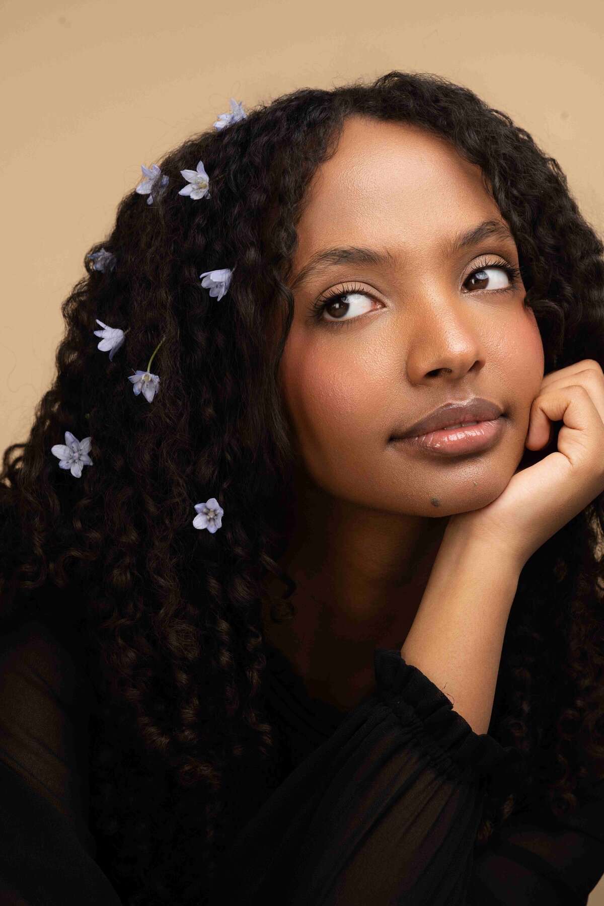 model posing with flowers in her hair