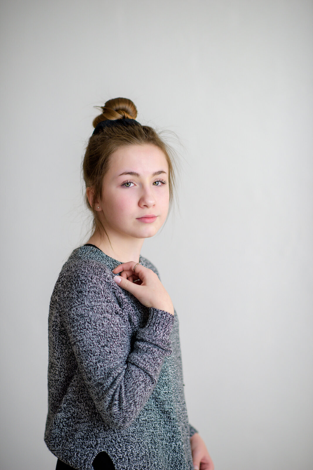 Tween girl looking stoic in Boise photography studio.