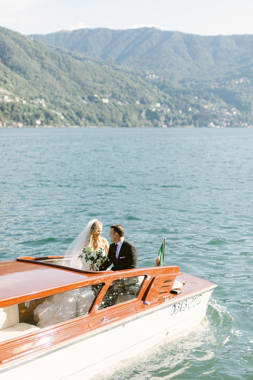 boat ride at lake como with bride and groom
