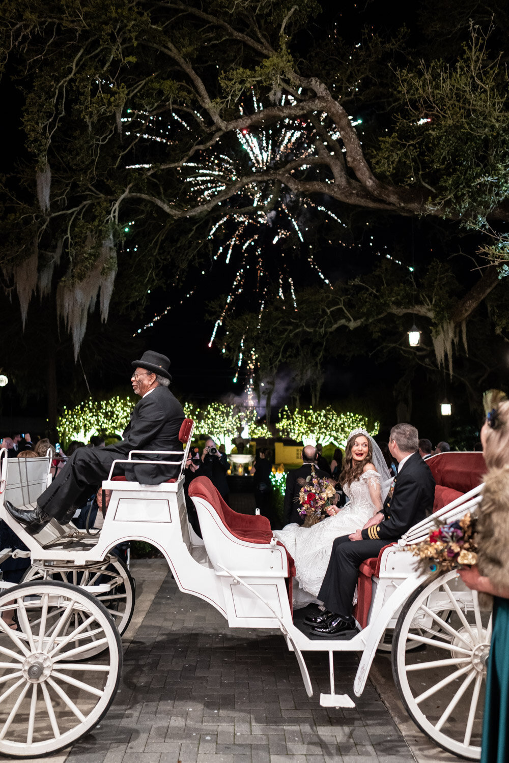Bride and groom in carriage watching fireworks show at Southern Oaks