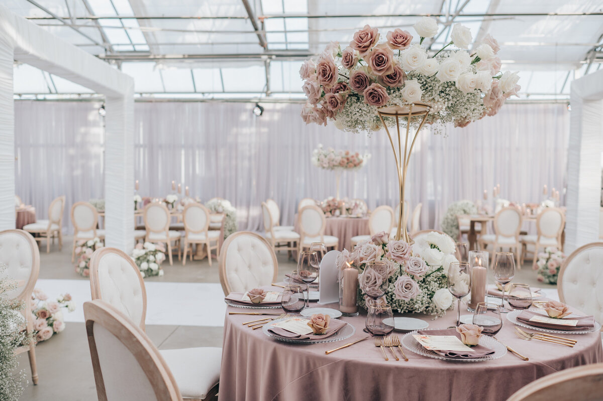Luxurious wedding dinning with lavender tablecloths and gold accents