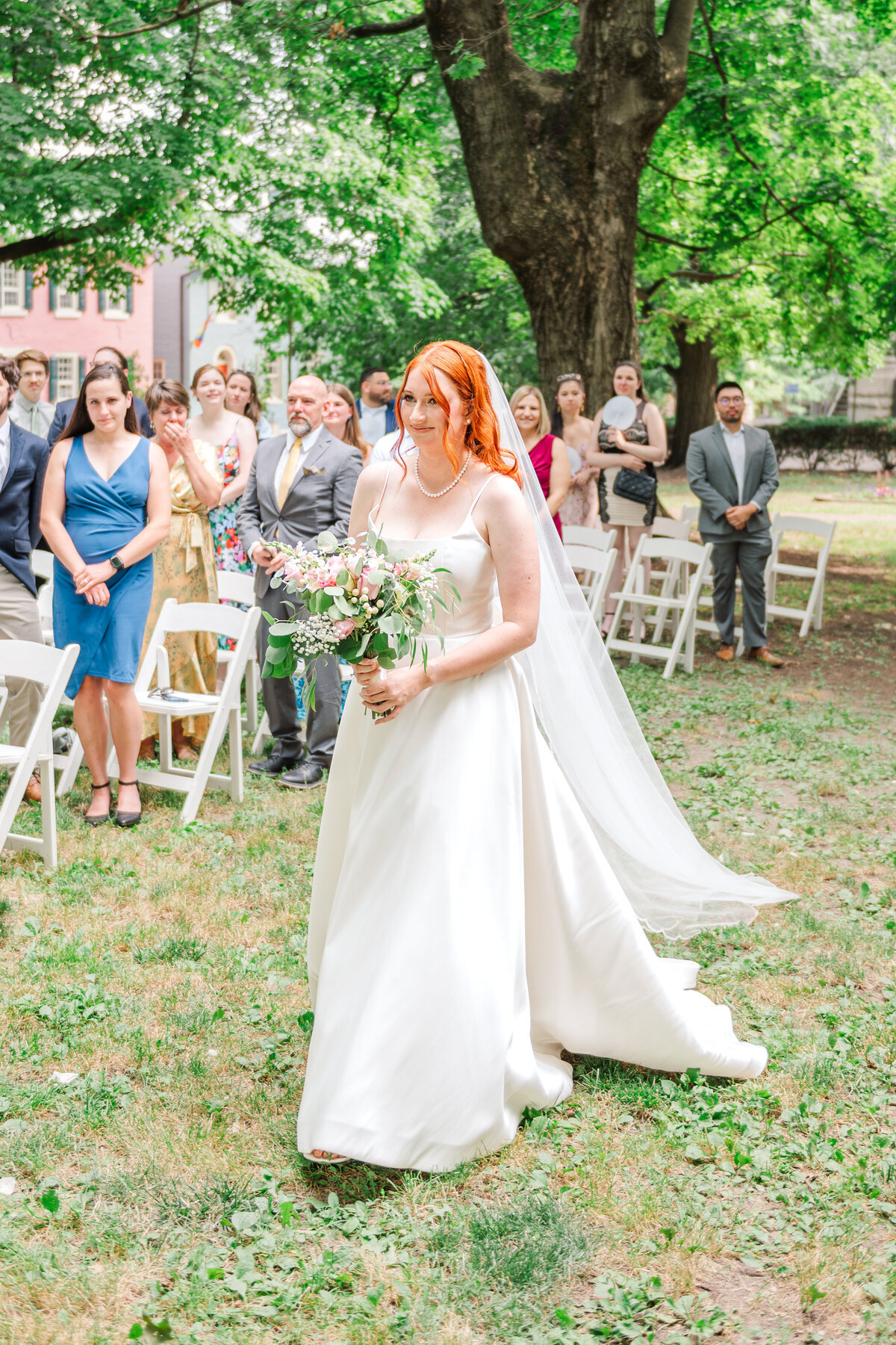 bride walking down the aisle to get married in Lexington