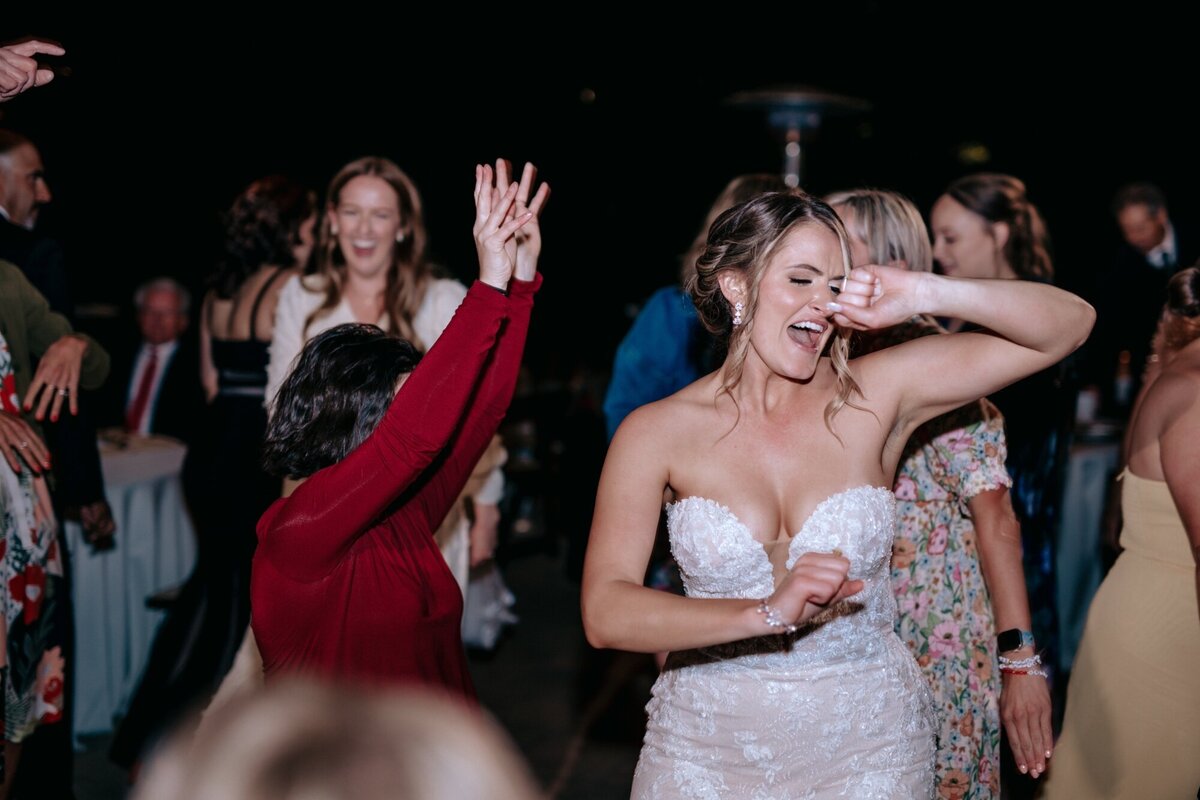 Bride dancing with her guests at the reception.