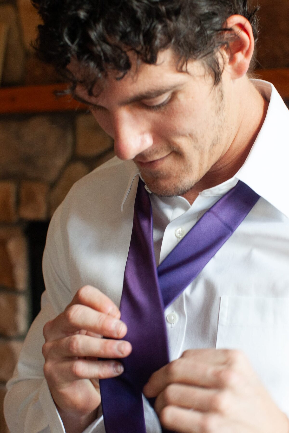 groom-tying-purple-tie