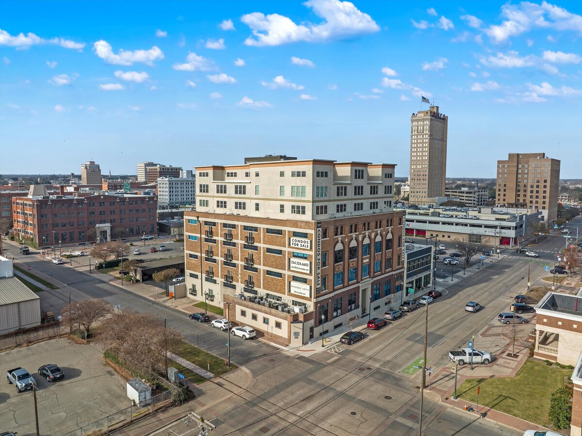 Historic Behrens Loft building which holds this one-bedroom, one-bathroom loft vacation rental condo with high speed WiFi, fully stocked kitchen, and room for four guests in downtown Waco, TX.