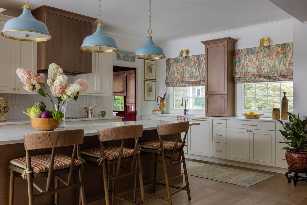 melinda chesson interiors poindexter  kitchen with colorful window curtains and blue color accents