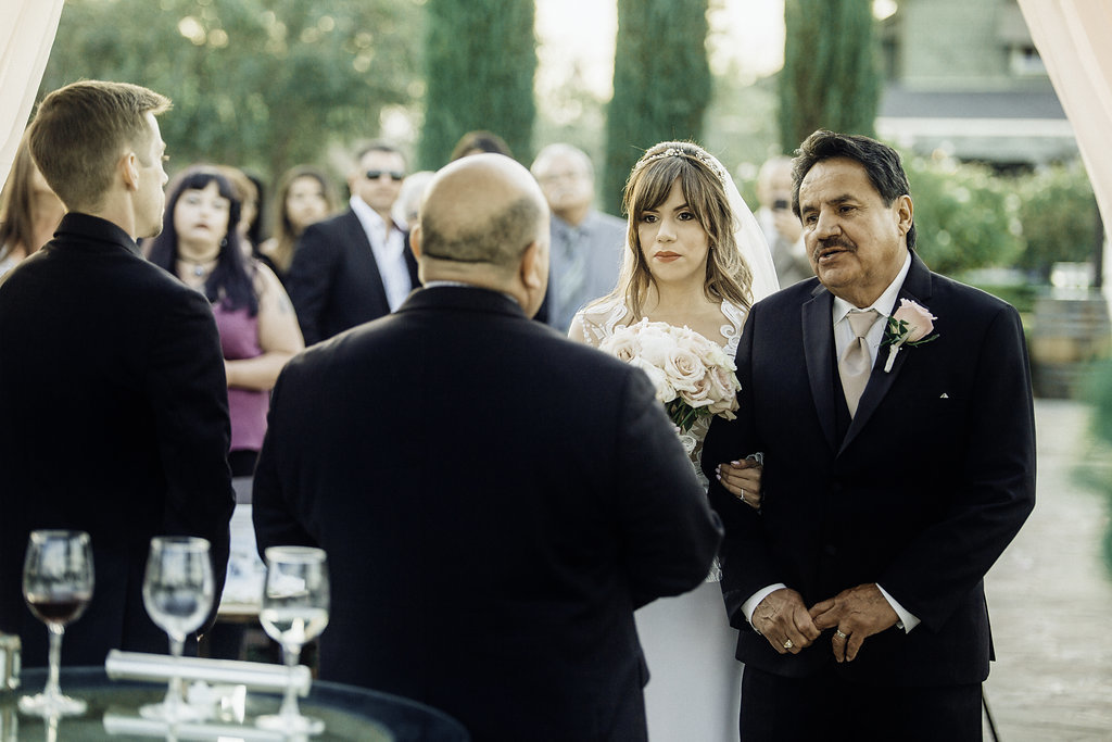 Wedding Photograph Of Three Men in Black Suit  And The Bride Los Angeles