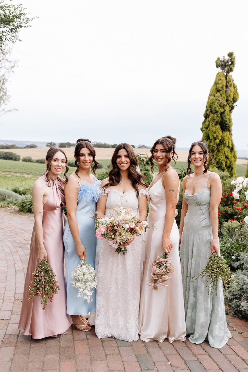 Julia and bridal party having portraits taken