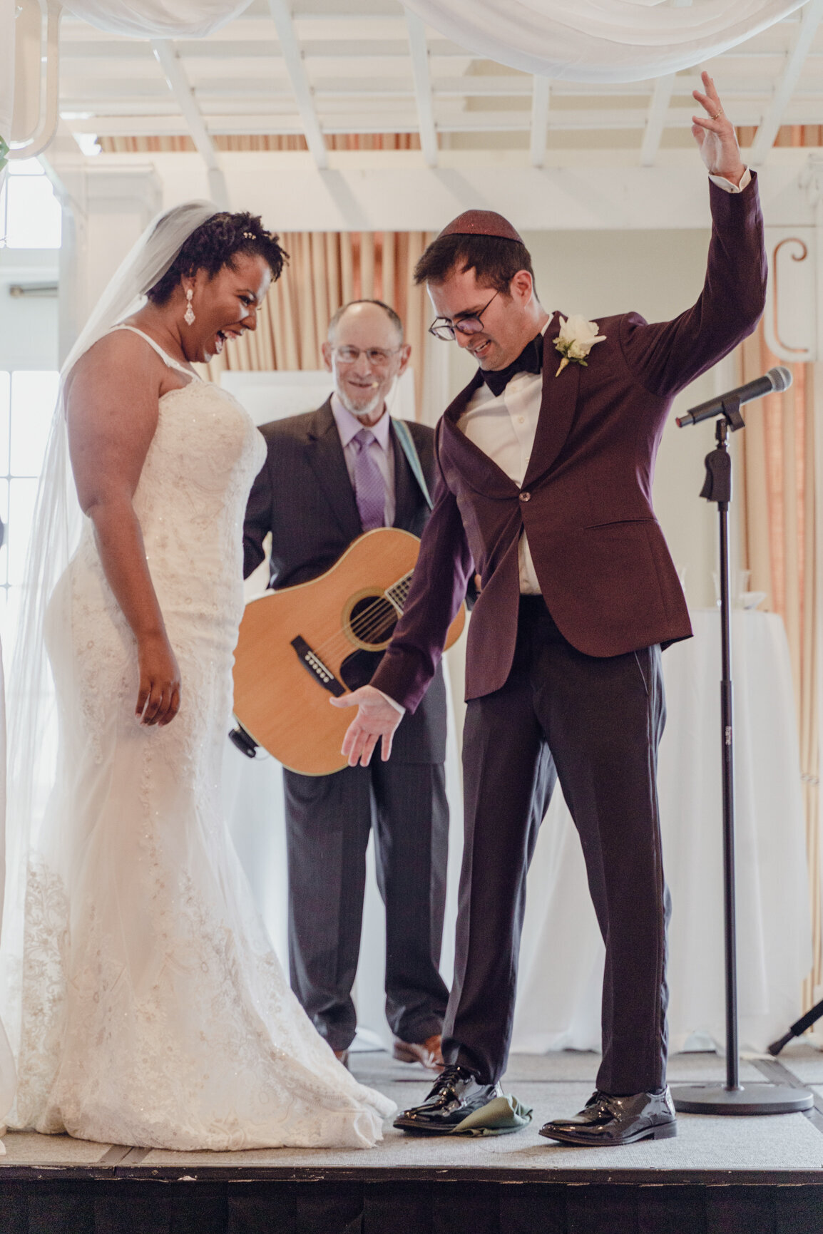 Groom breaks glass during  Jewish ceremony