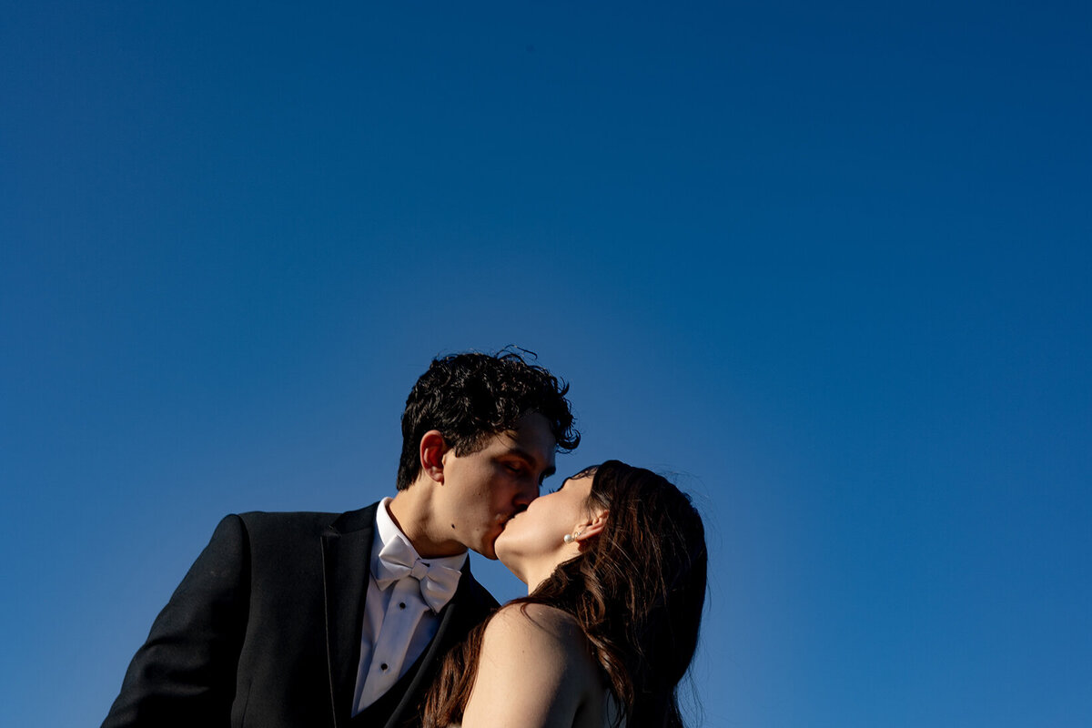 retro-style-kissing-wedding-portrait-golden-hour