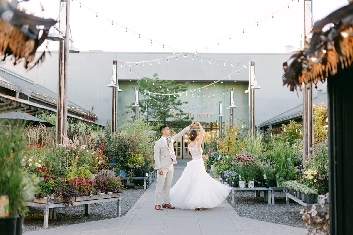 bride and groom in front of anthropologie at terrain