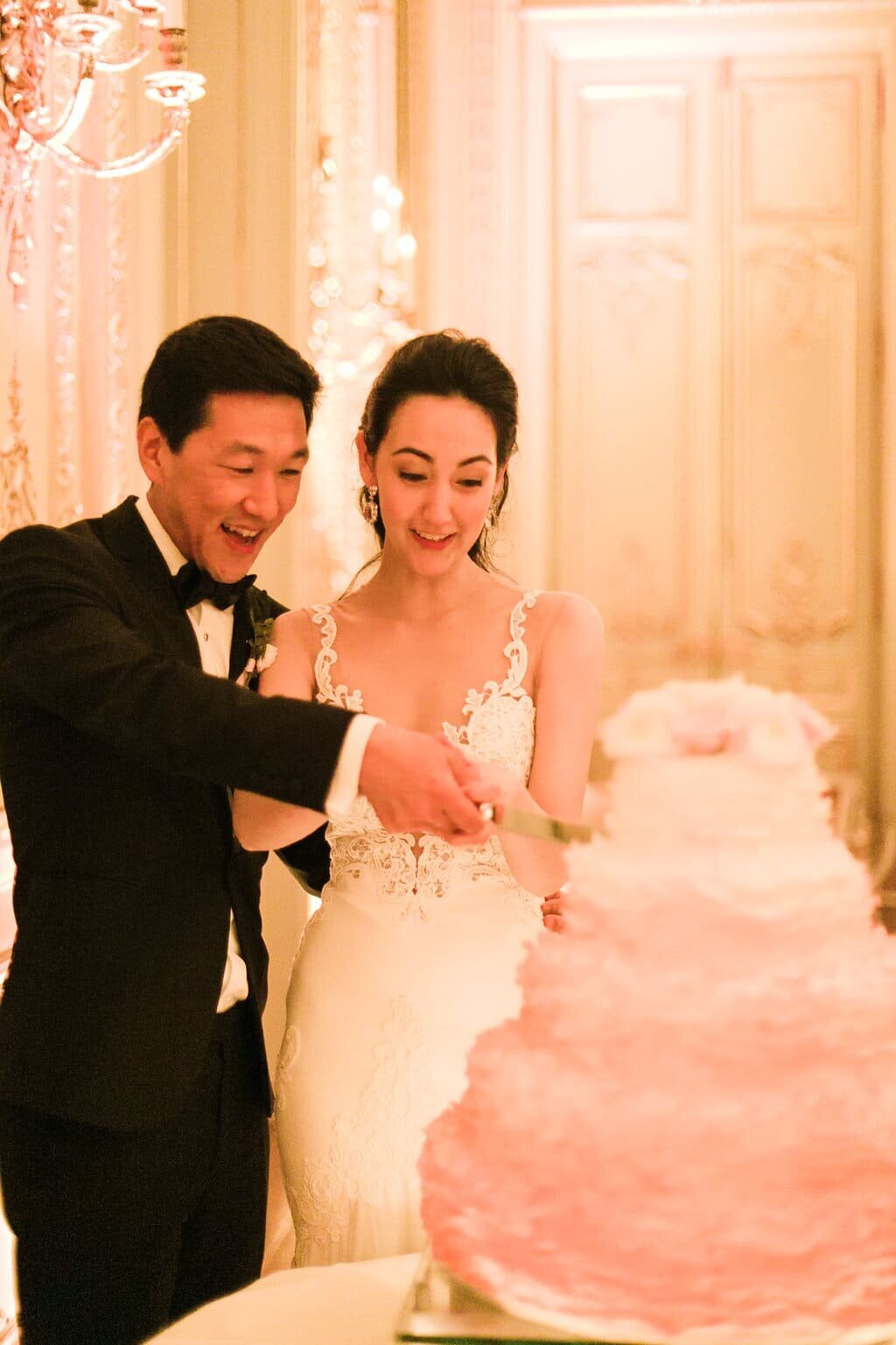 Wedding-cake-cutting-white-pink-cake
