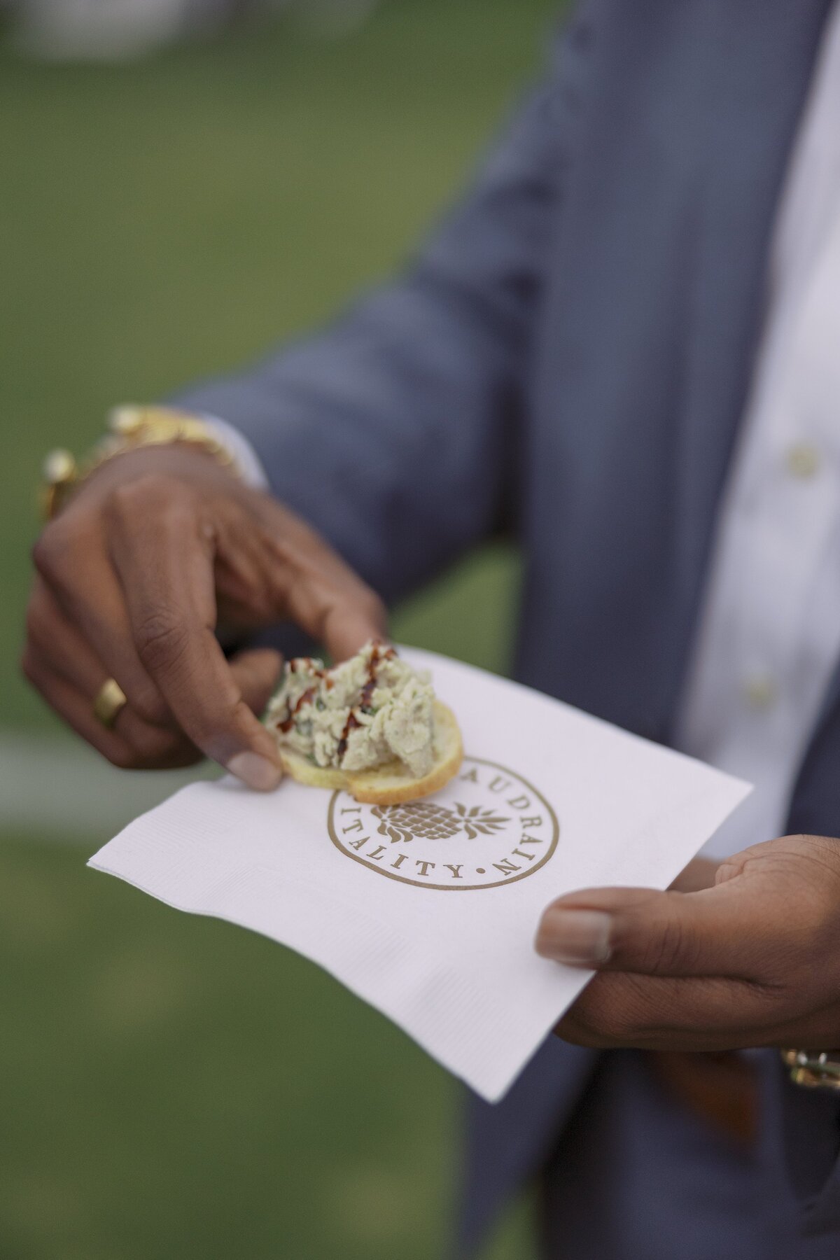 Guests mingle on the lawn of the Tennis Hall of Fame  in Newport during a welcome party. 