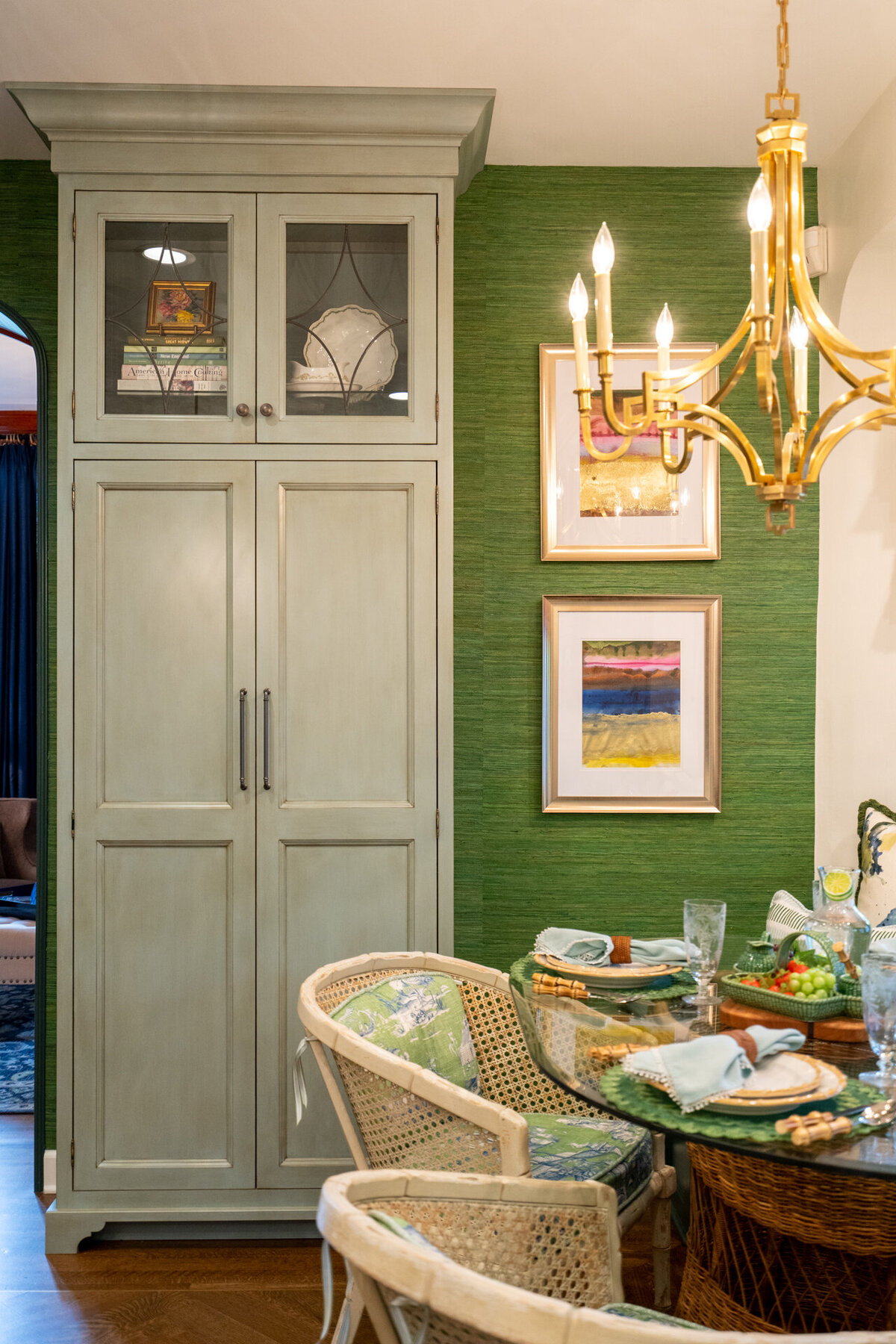 kitchen with green china cabinet and green wallpaper