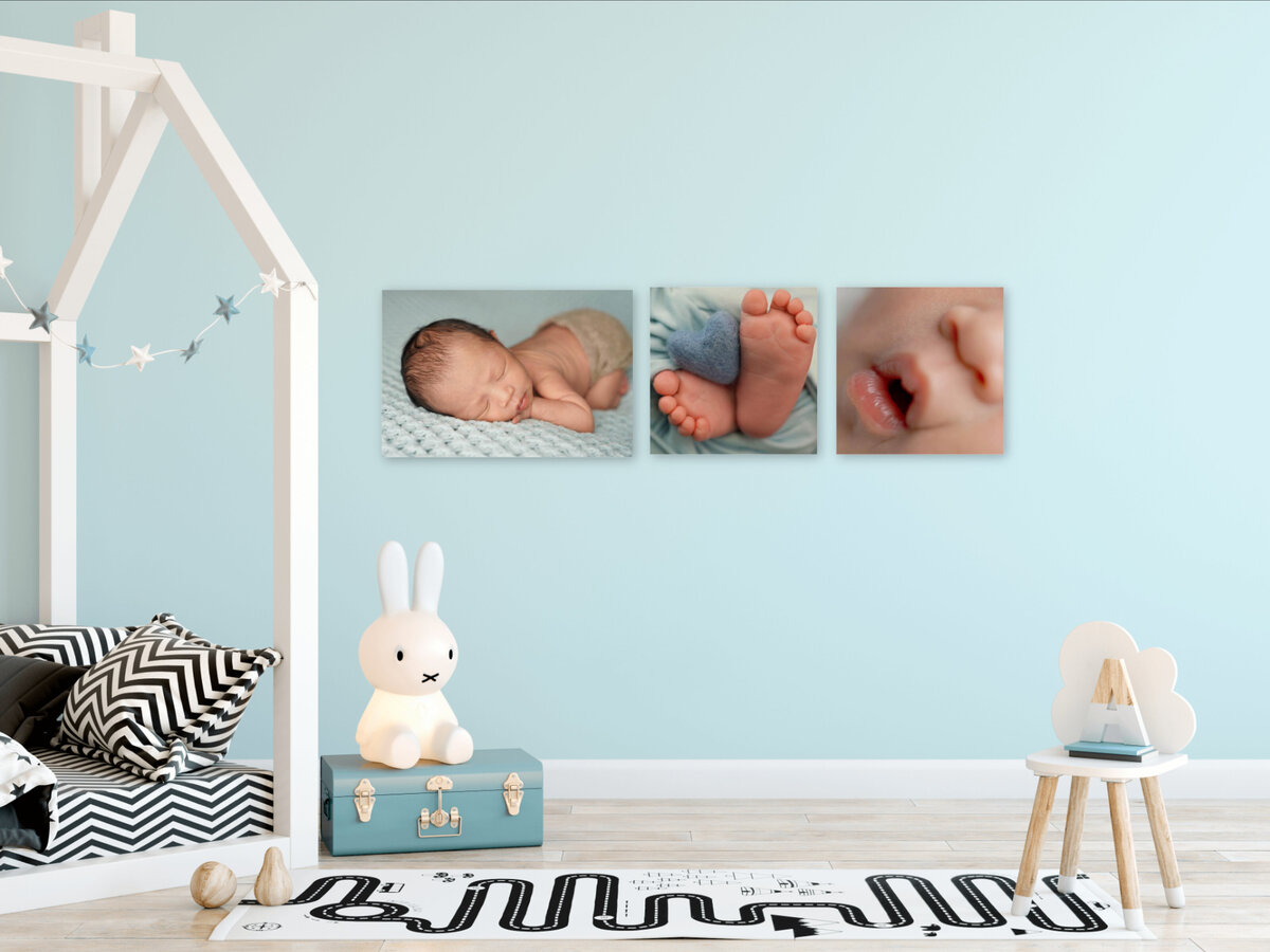 Newborn portraits hanging on wall in clients home