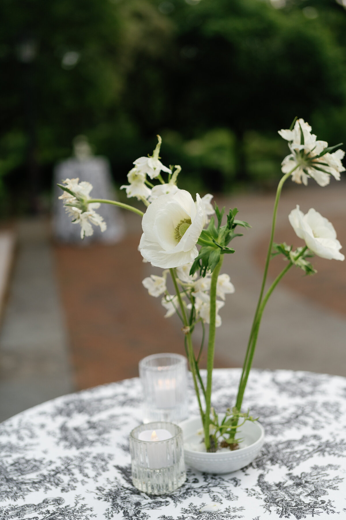 organic-ikebana-centerpieces-cocktail-table-votive-candle-garden-wedding-httpswww.todaysbridesf.cominspirationmodern-sophisticated-black-amp-white-wedding