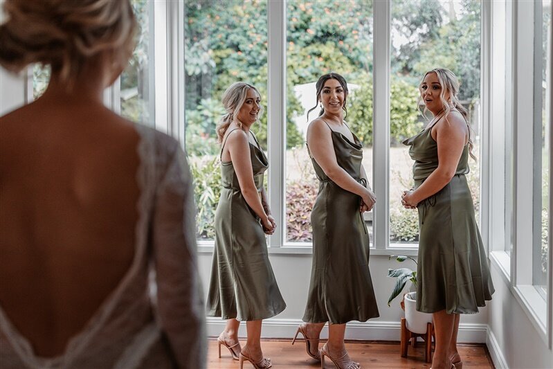 "Discover the enchanting allure of our bridesmaids' first looks! Dive into a world of timeless elegance and exquisite fashion as our bridesmaids unveil their stunning attire.
