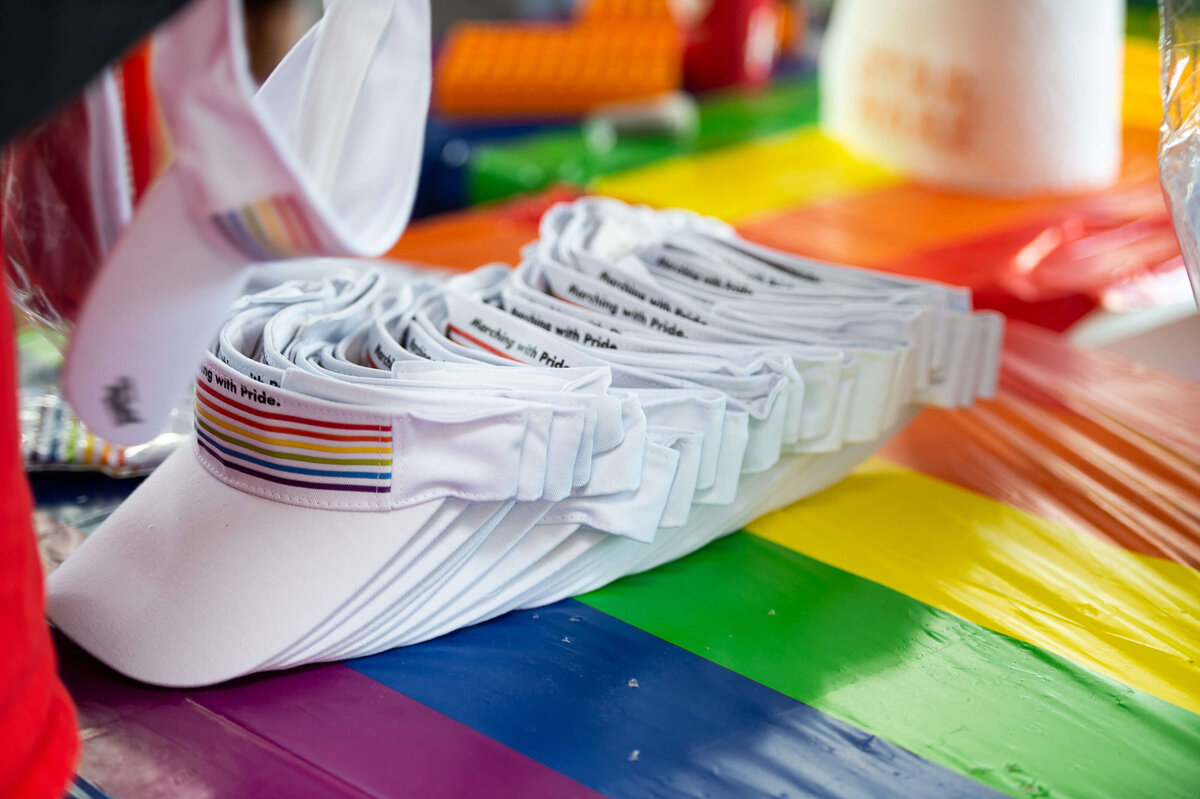 a closeup photo of visors showing the rainbow pride logo as part of the Tweed Canopy Growth pride parade.  Captured by Ottawa Event Photographer JEMMAN Photography COMMERCIAL