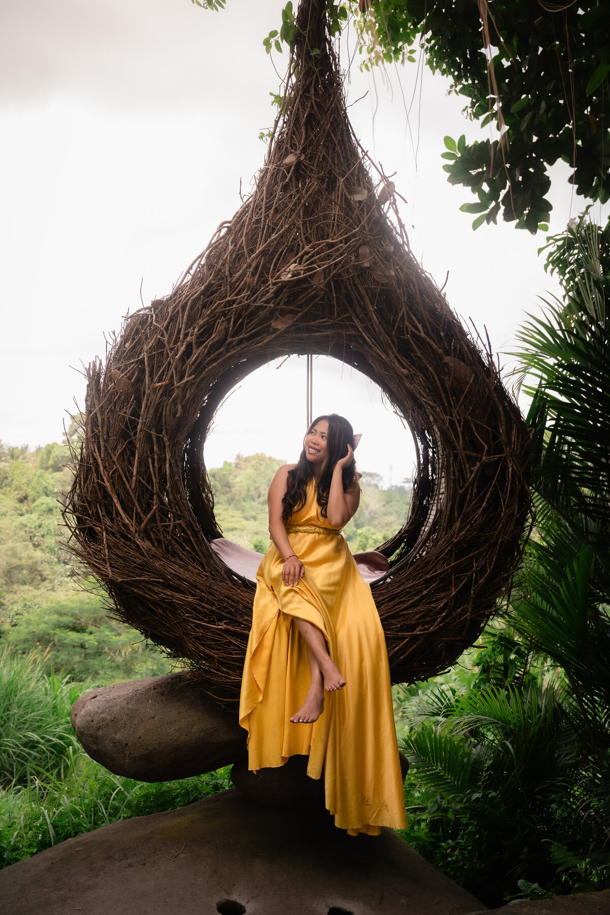 Bali Indonesia Elopement Asian Bridal portrait wearing yellow dress at Ubud swing.