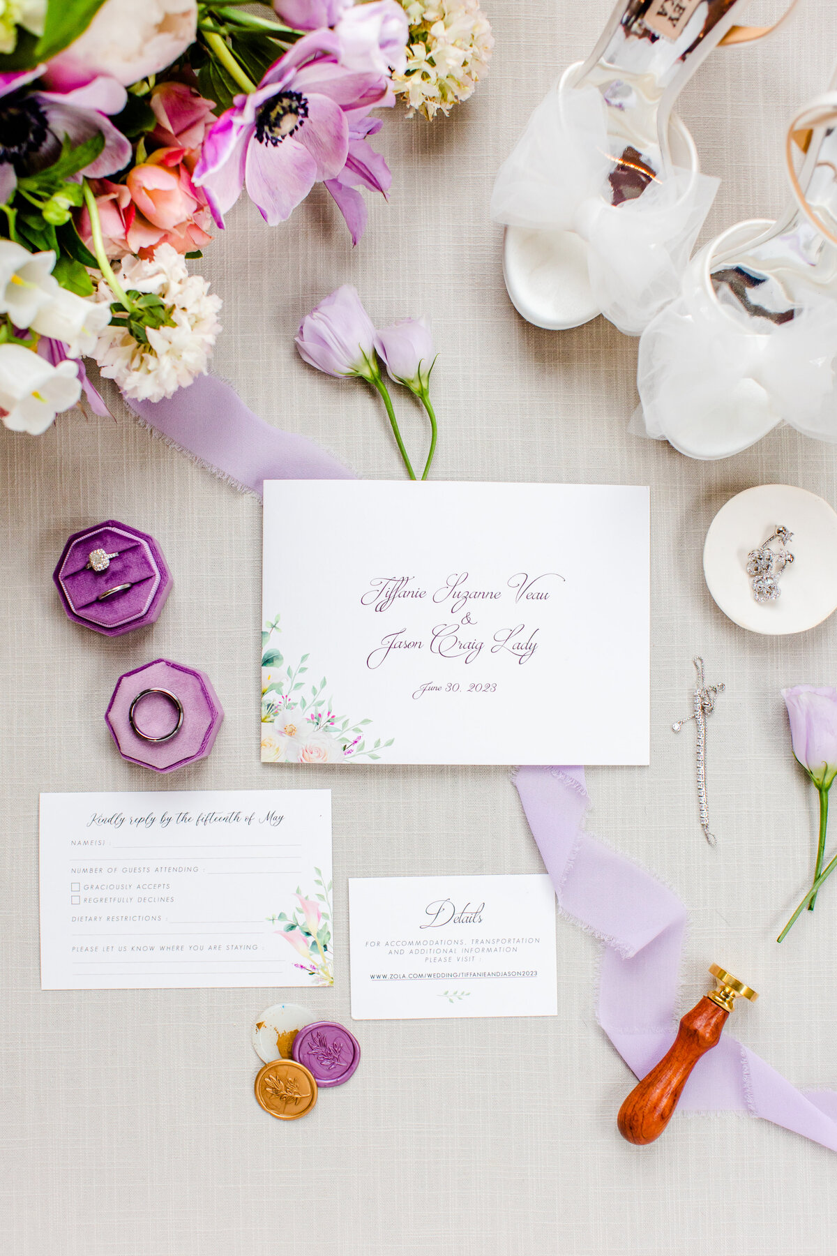 flatlay of wedding stationery with lavender details
