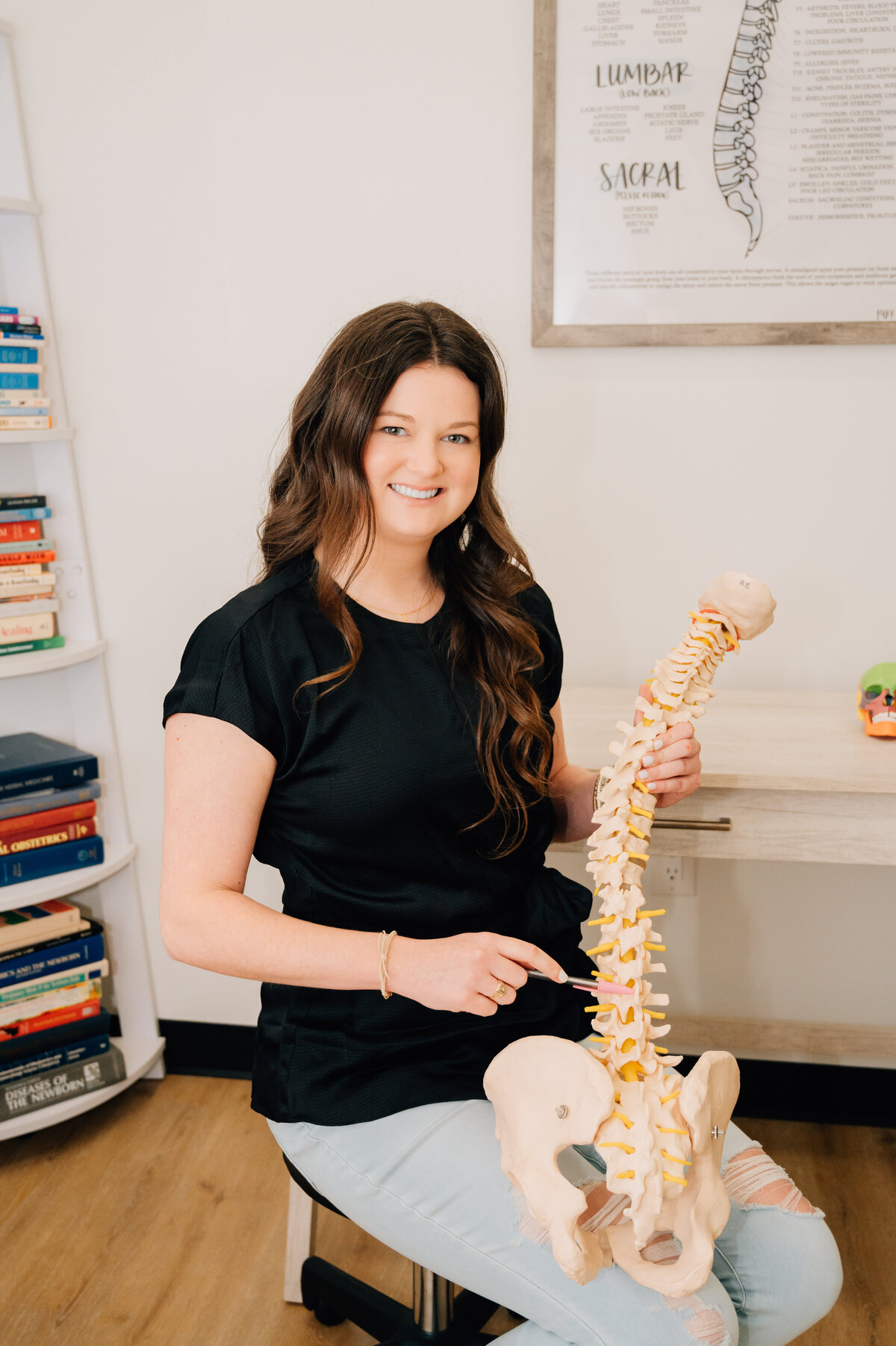 Spine model in treatment room by Houston TX wellness branding photographer