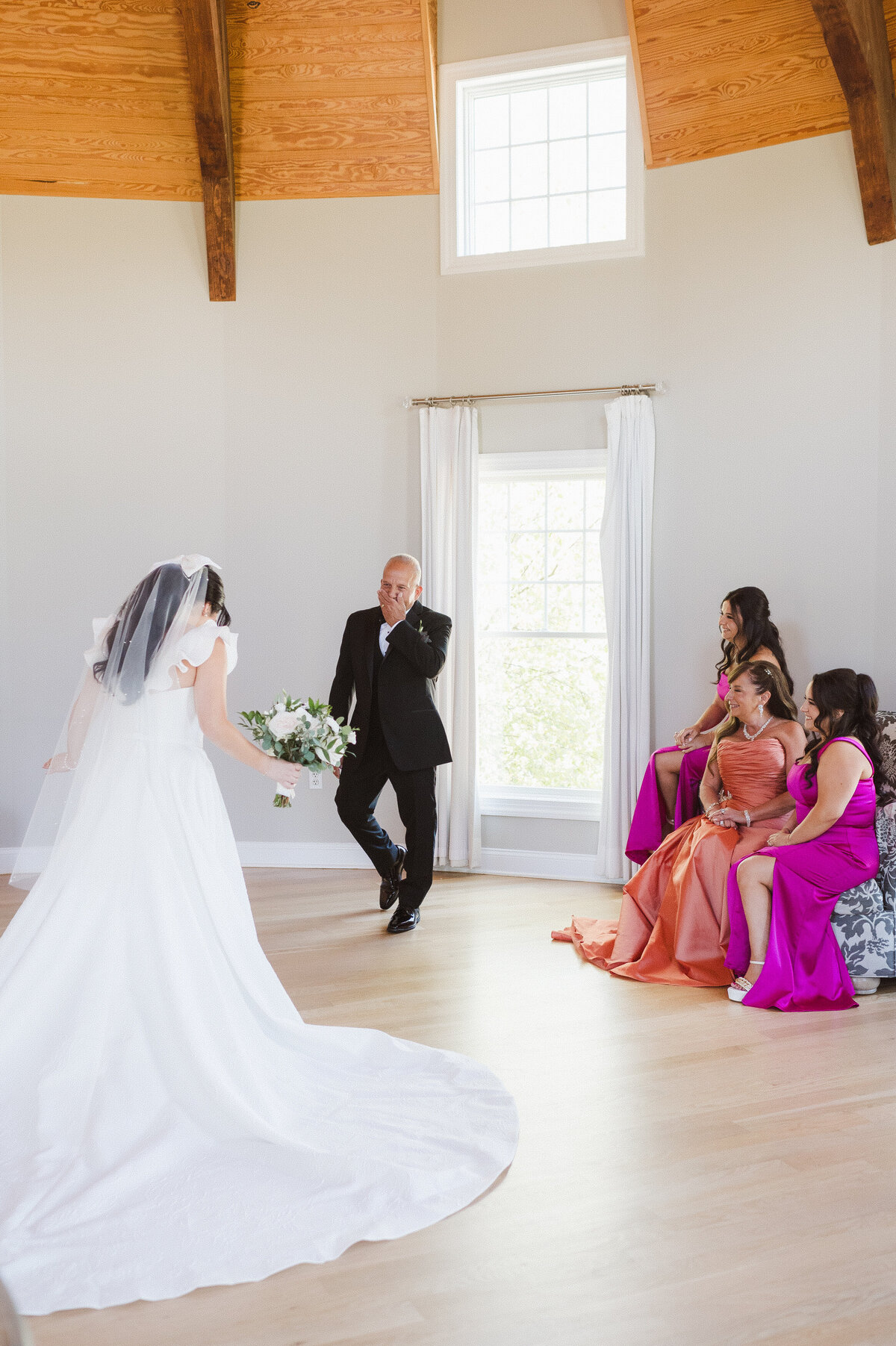 First look bride and her family in getting ready suite at Bear Brook Valley