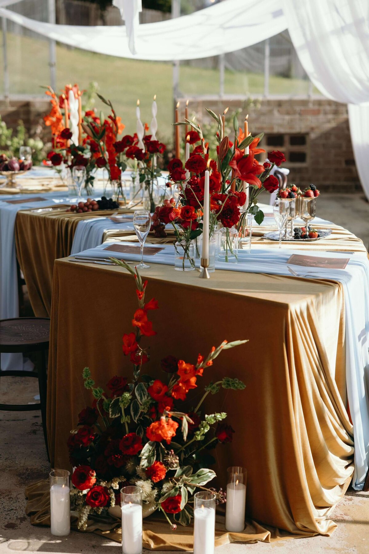 curved-table-gold-velvet-red-florals