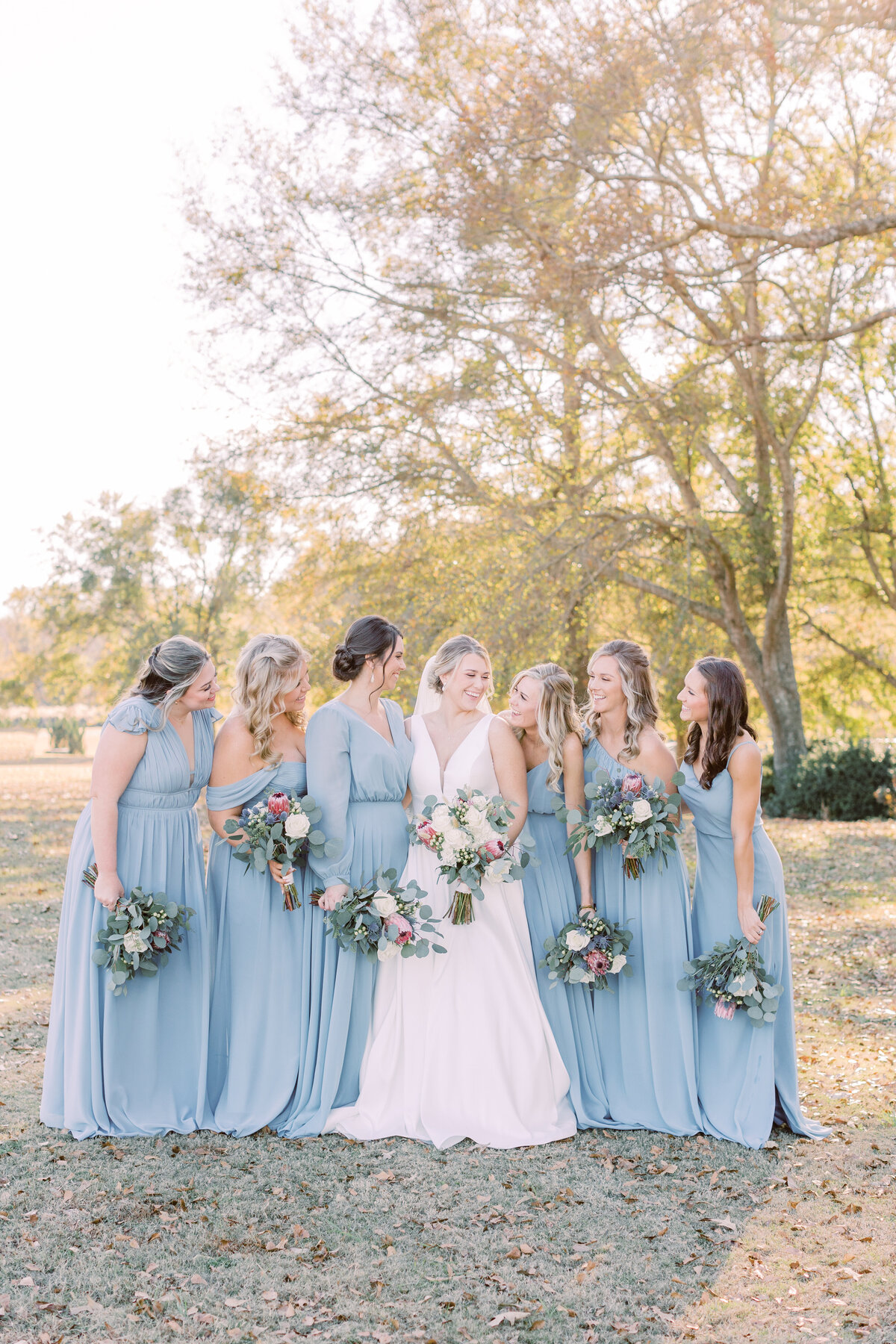 bride and bridesmaids  with bouquets